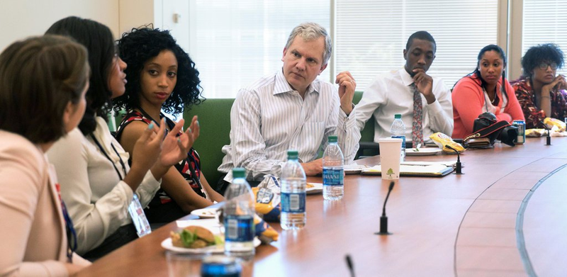 New York Times Publisher Arthur Sulzberger Jr., listens to a question from Kendall Trammell, second from left, during a luncheon with students from the New York Times Student Journalism Institute in 2016 in the newsroom building in Manhattan. (James Tensuan/New York Times Student Journalism Institute)